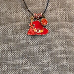 Witch Hat & Broom Pendant With Red Charm And On A Black Cord.